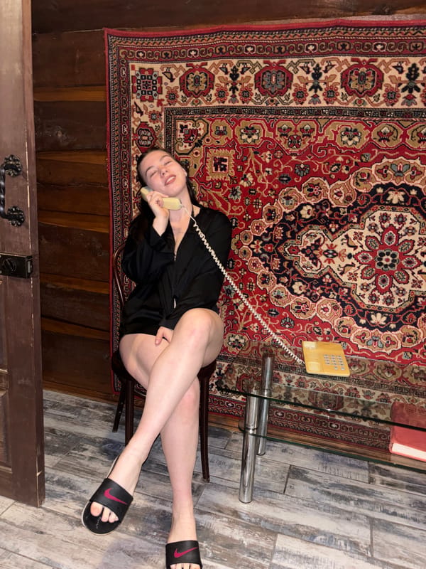 Woman takes phone call on floor in Perm home