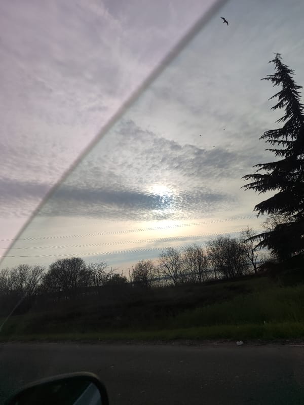 Vehicle occupant observes cloudy sky in Burgas, Bulgaria