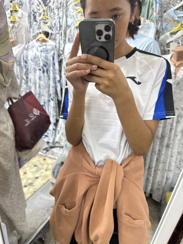 Morning market run through Kara-Suu's busy clothing bazaar