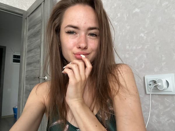 Indoor selfie session with various poses and outfit changes