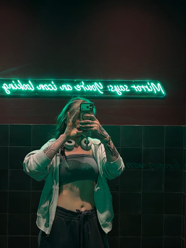 Woman takes selfies in athletic wear in Belgrade interior