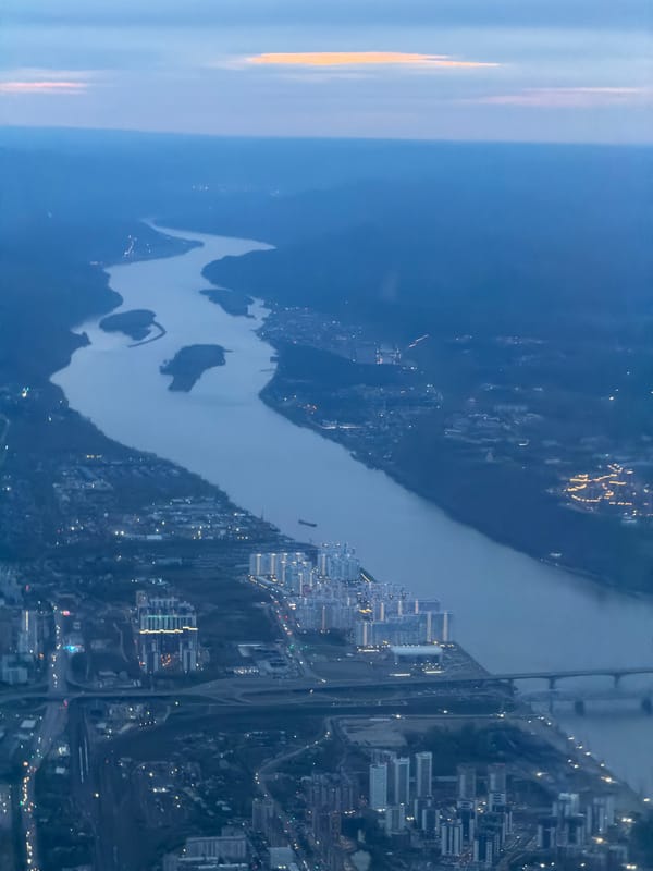 Dusk aerial view captures Mar'yasovo cityscape along Russian river