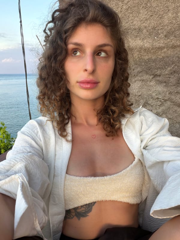 Woman Takes Selfies at Scenic Abang Indonesia Coastal Overlook
