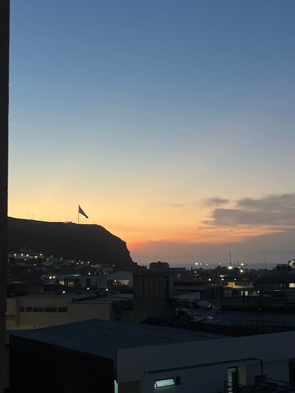 Chilean flag captured waving at twilight in Arica