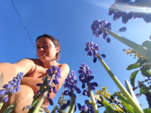 Mother and toddler enjoy spring morning garden play in Russia