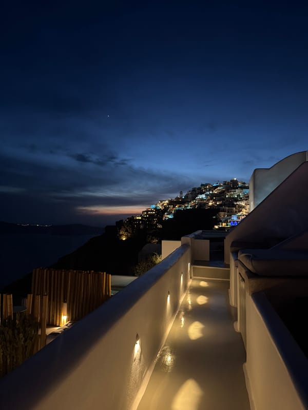 Nighttime view captured from lit structure in Thira, Greece