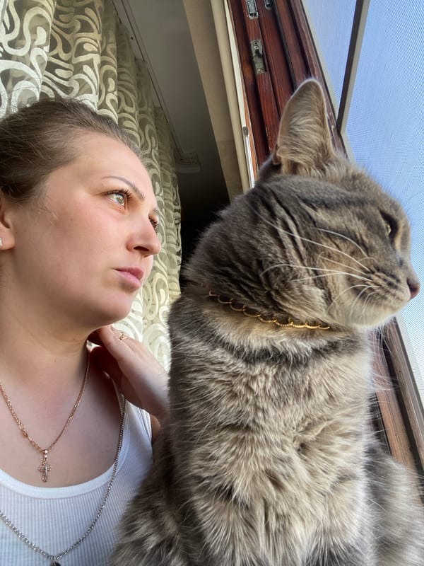 Early morning domestic moments with woman and cat in Марковский