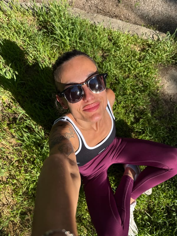 Woman films selfie, holds playing card in Pleven neighborhood