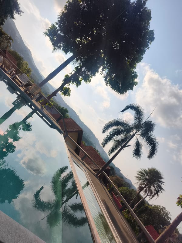 Child swims in outdoor pool in บ้านบางรักษ์, Thailand