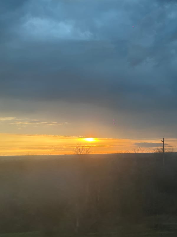 Dramatic sunset captured from moving vehicle in rural Russia