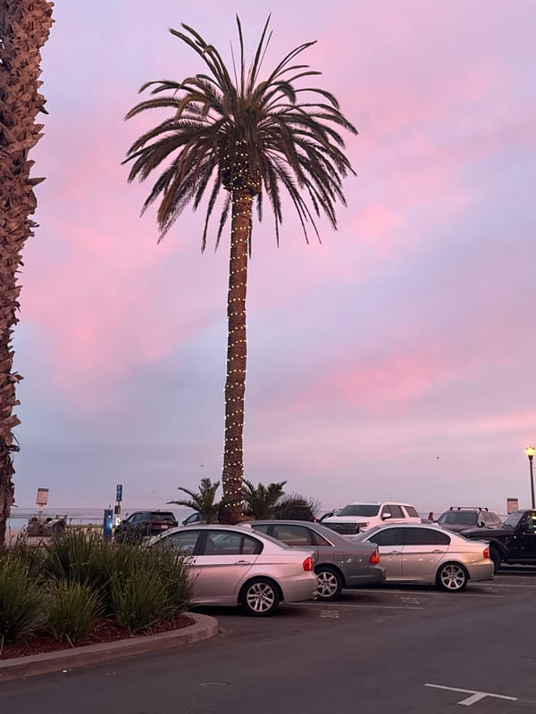 Dusk sky over a coastal street near 101 Grand Ave