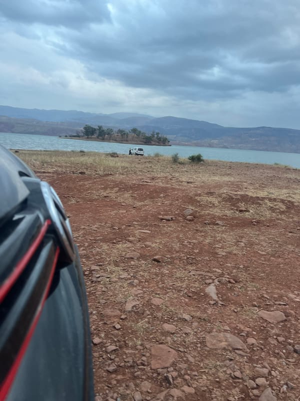 Traveler documents lakeside stop at Bin El Ouidane reservoir Morocco