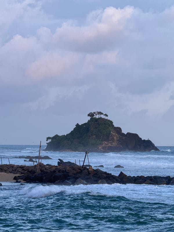 Sri Lanka's southern coast at golden hour — surf, palms, and village life