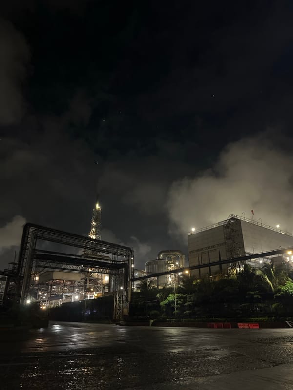 Industrial complex with cooling tower observed at night in Indonesia