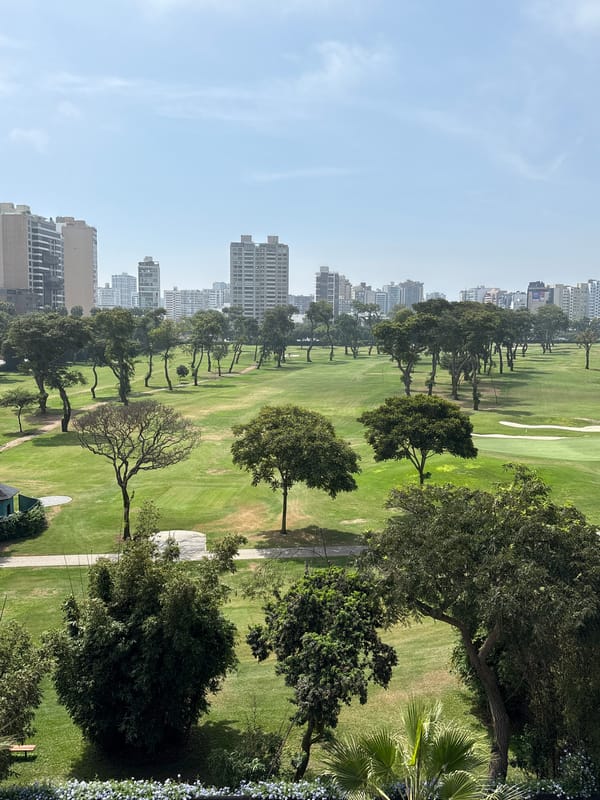 Elevated views captured of golf course and dining in San Isidro