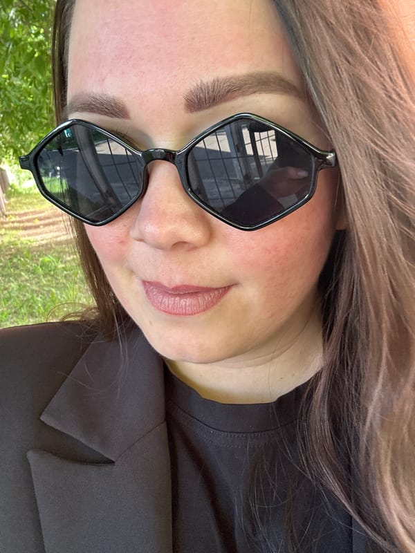Woman in sunglasses spotted outdoors Sunday afternoon