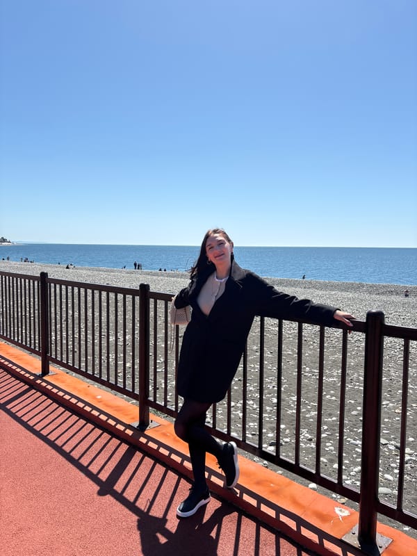 Woman photographed on sunny Sochi promenade Friday morning