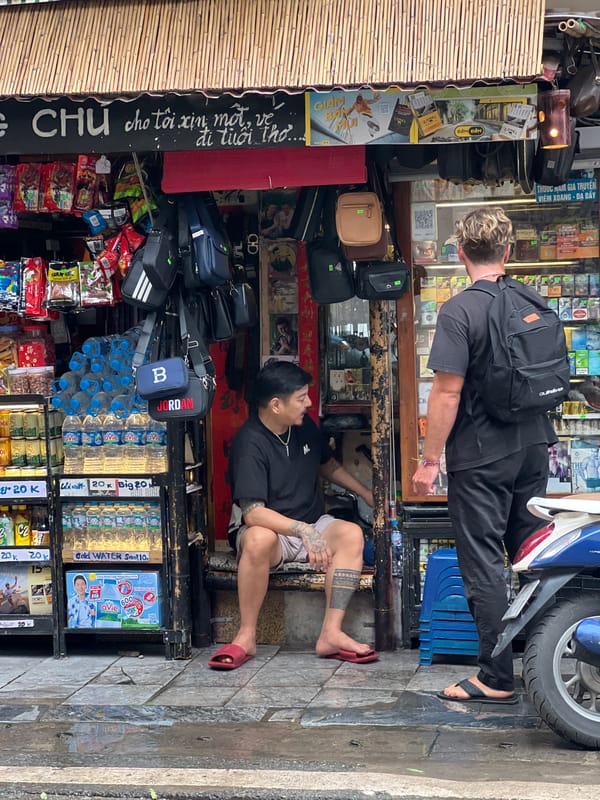 Hanoi street commerce and traffic on a busy morning