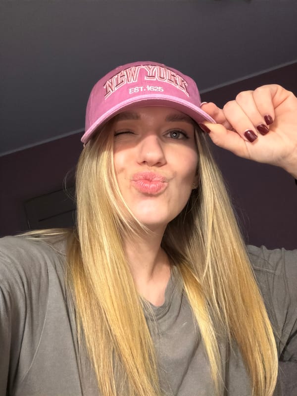 Woman conducts selfie photo session in Dreiliņi, Latvia