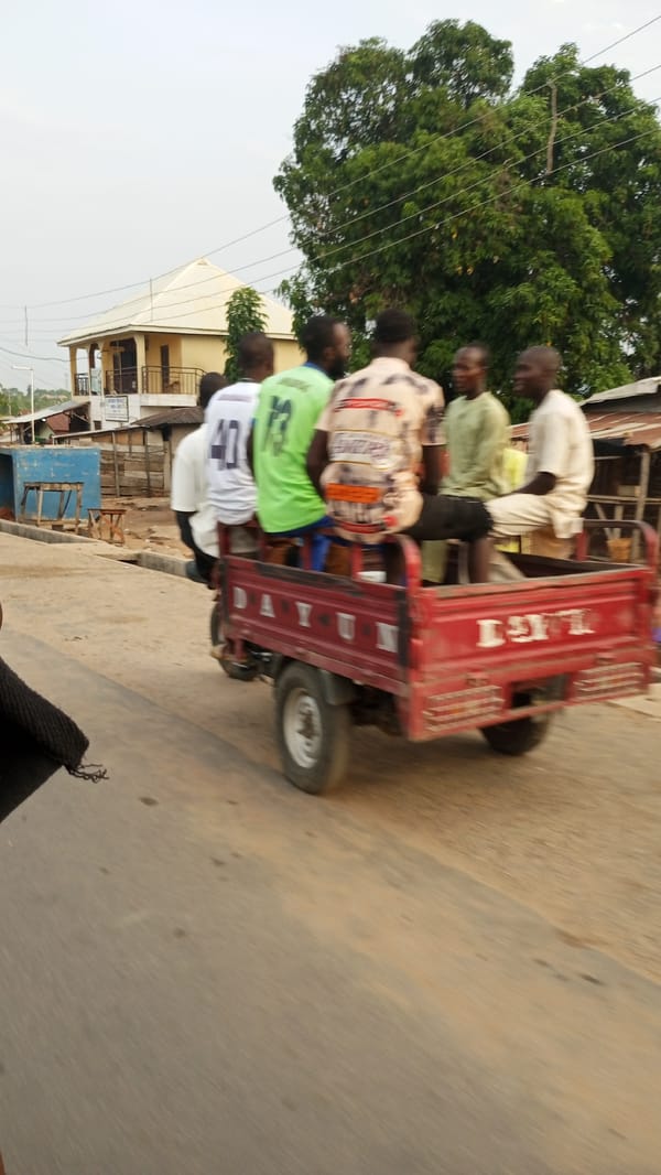 Six men ride tricycle flatbed in Zango-ndaji, Nigeria