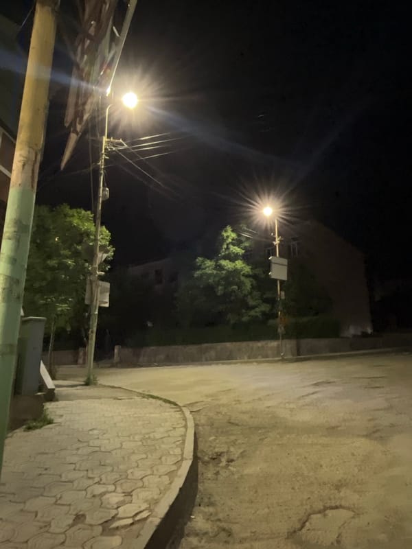 Quiet night streets of Yeghegnadzor, crescent moon overhead