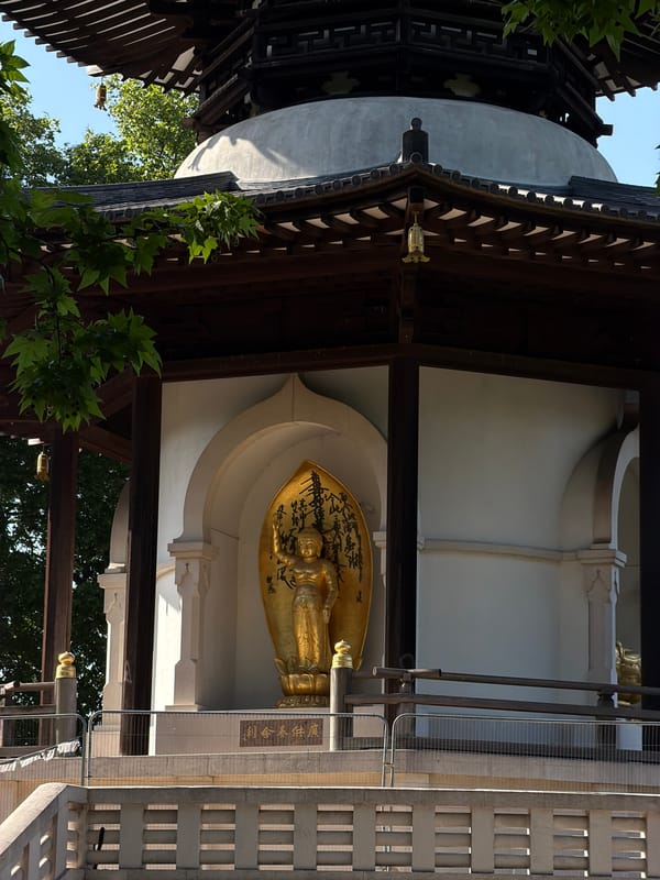 Golden reclining Buddha statue observed in London building