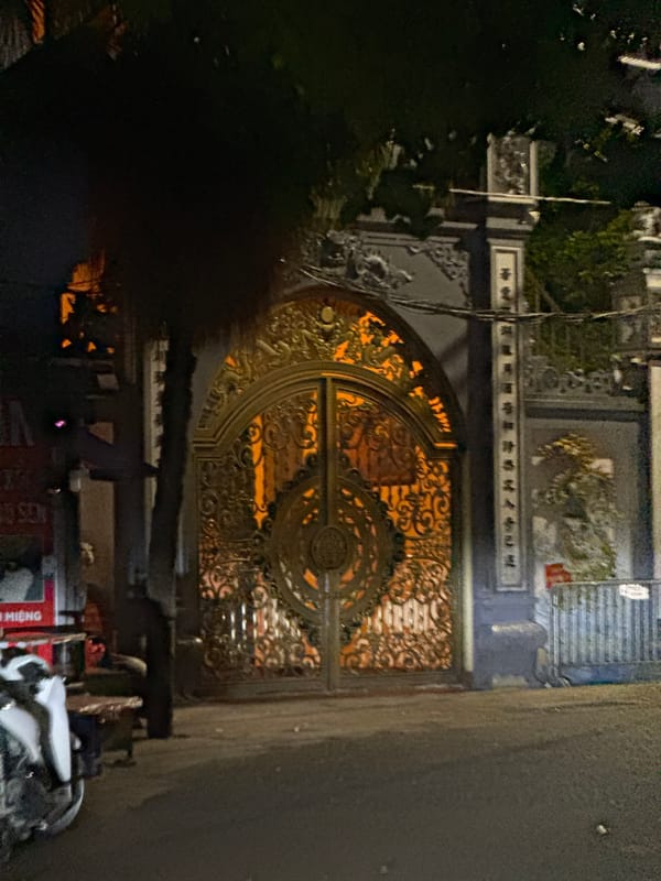 Hanoi at night: gates, streets, and city lights