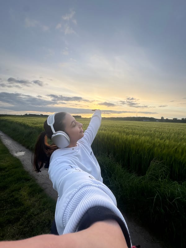 Person poses peacefully on countryside path near Mönchengladbach