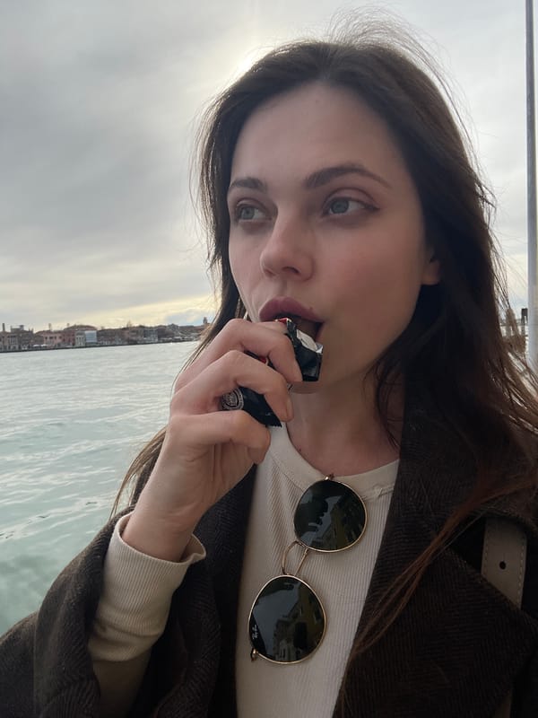 Tourist takes selfie along Venice canals amid historic architecture
