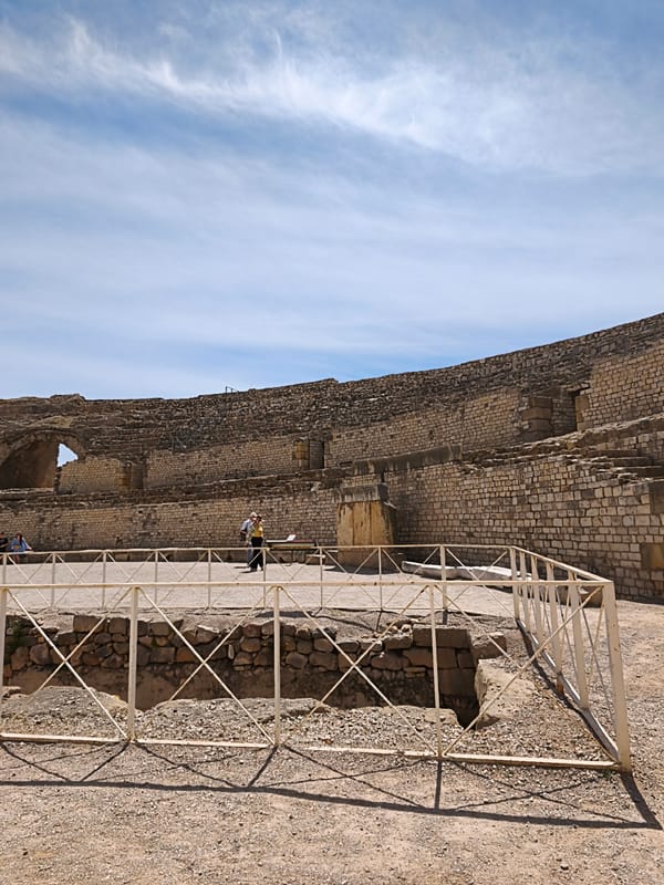 Visitor documents Roman Amphitheater ruins in sunny Tarragona