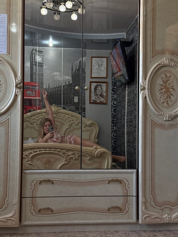 Person captures mirror selfie in bedroom, Chaikovsky Russia