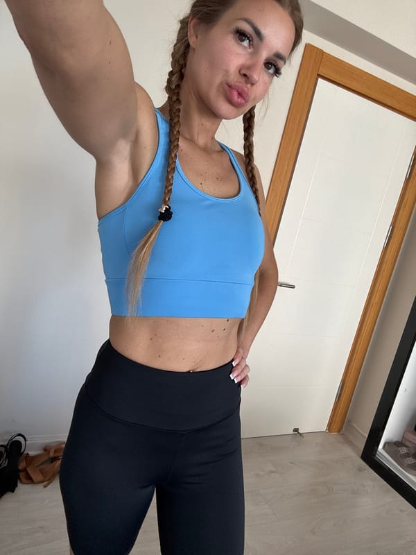 Woman takes indoor selfies in athletic wear in Erdemli