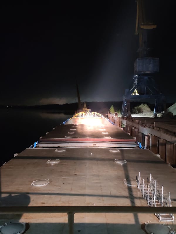 Nighttime barge operations documented at Tver River port