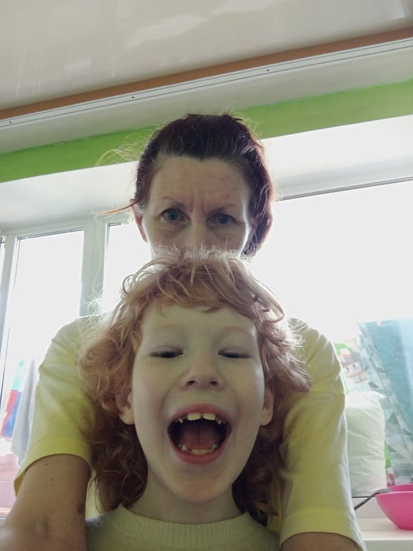 Lazy morning at home in Blagoveshchensk with a red-haired kid