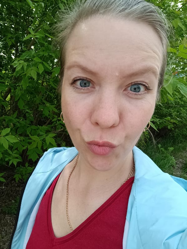 Woman documents spring morning with selfies and flower photography