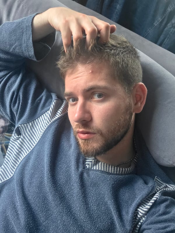 Man rests on couch, gives thumbs-up in Yagodovo