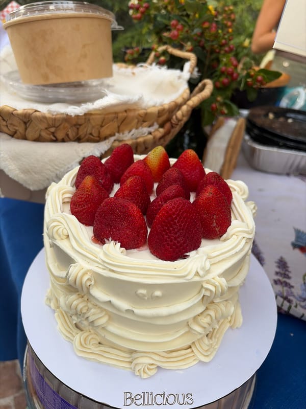 Garden party with cake, dining setup documented by witnesses