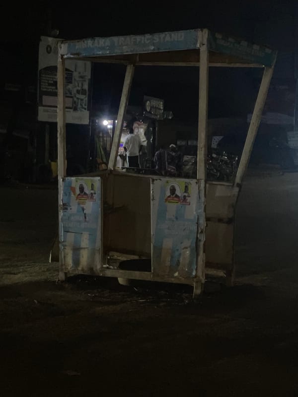 Nighttime street vendors serve customers in Abraka, Nigeria