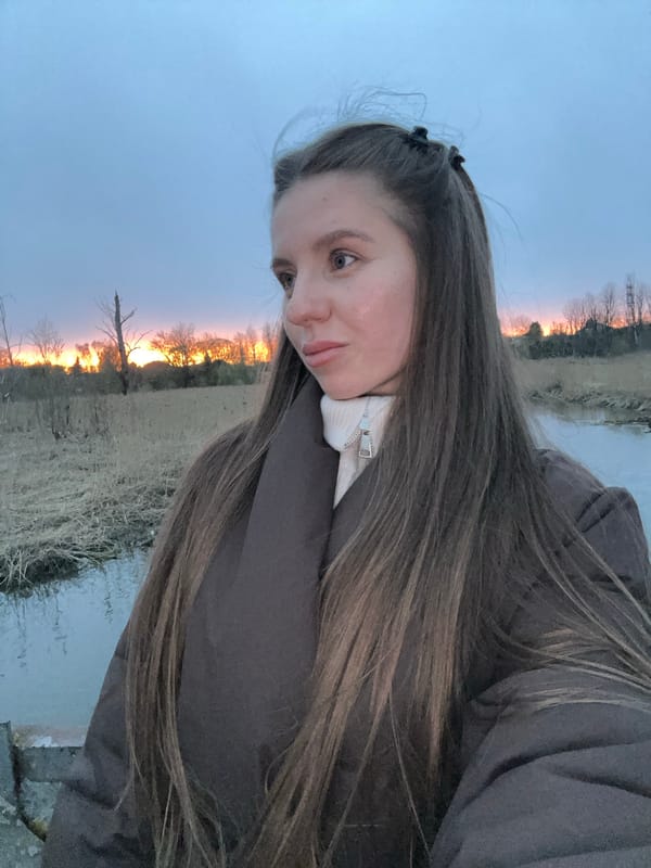 Woman photographed on bridge during sunset in Klin, Russia