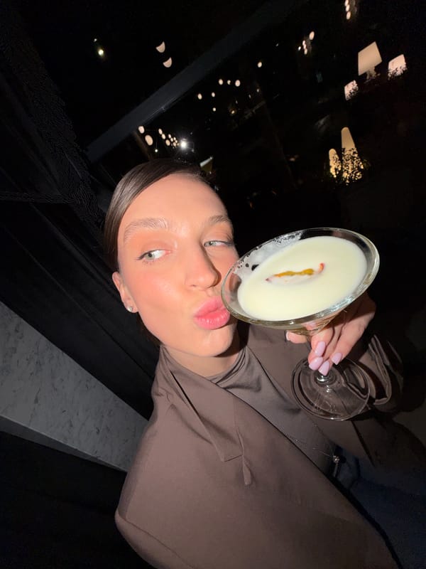 Woman enjoys cocktails at Budva establishment Saturday evening