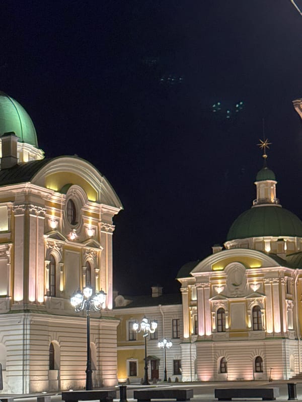 Illuminated domed building photographed at night in Tver, Russia