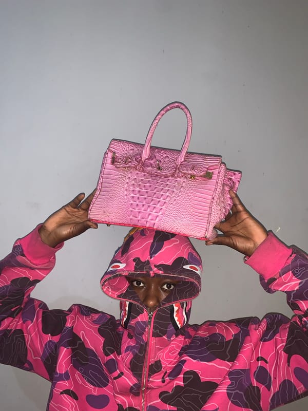 Person in designer camouflage hoodie spotted with luxury items
