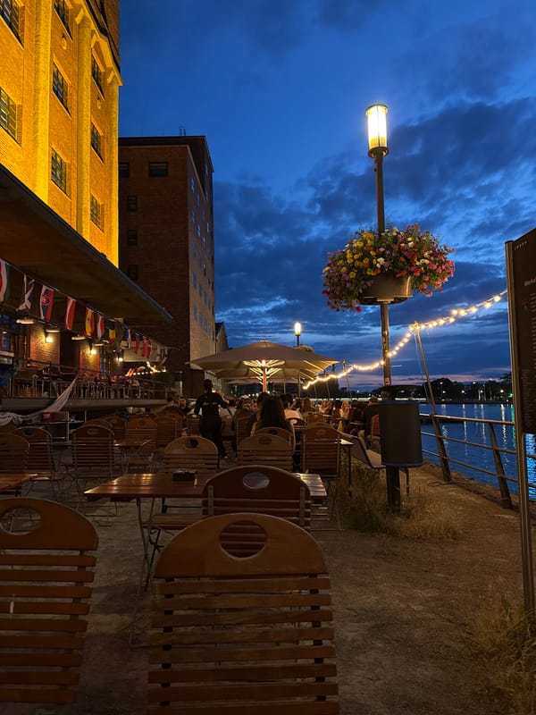 Duisburg's inner harbor at twilight, restaurant and canal reflections