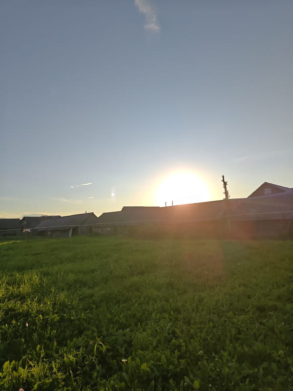 Warm sunset gradient over rural Alashayka, Russia