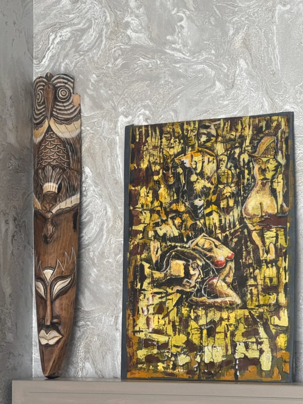 Art display with painting and carved masks in Tbilisi