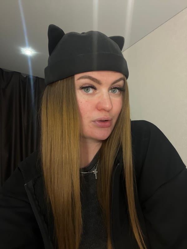 Woman in cat-ear beanie photographed multiple times indoors