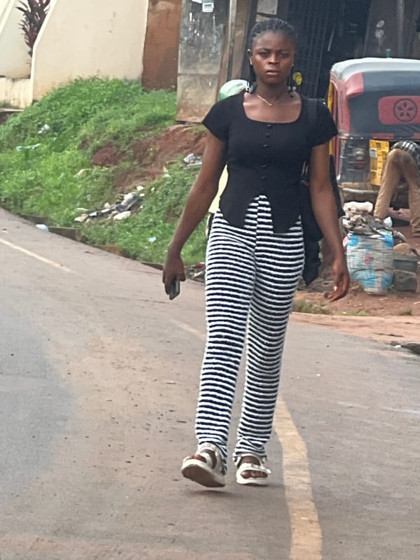 Morning street life and roadside repairs in Nkpor, Nigeria