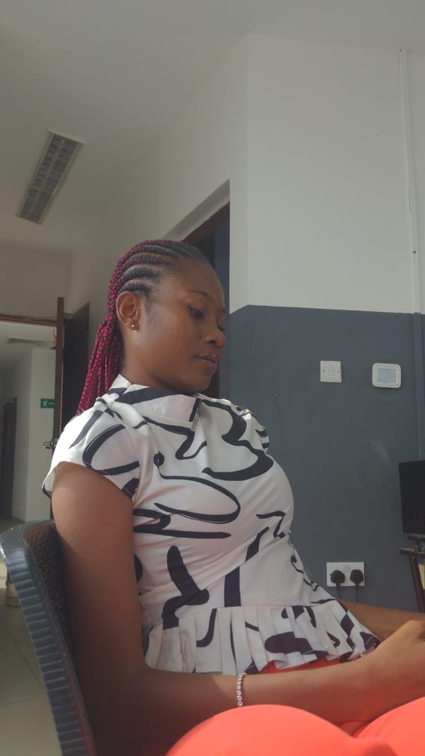 Woman with red braids captured in casual moments, Abuja