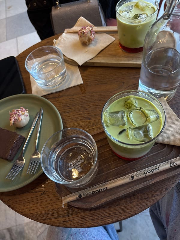 Café patron enjoys iced matcha latte in Varna, Bulgaria