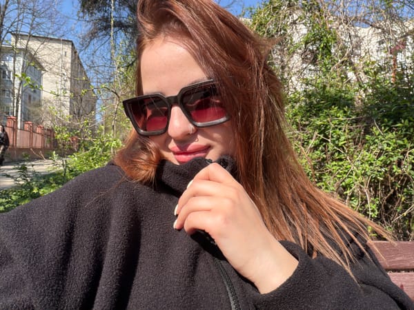 Woman with baby enjoys morning outing in Krasnodar park